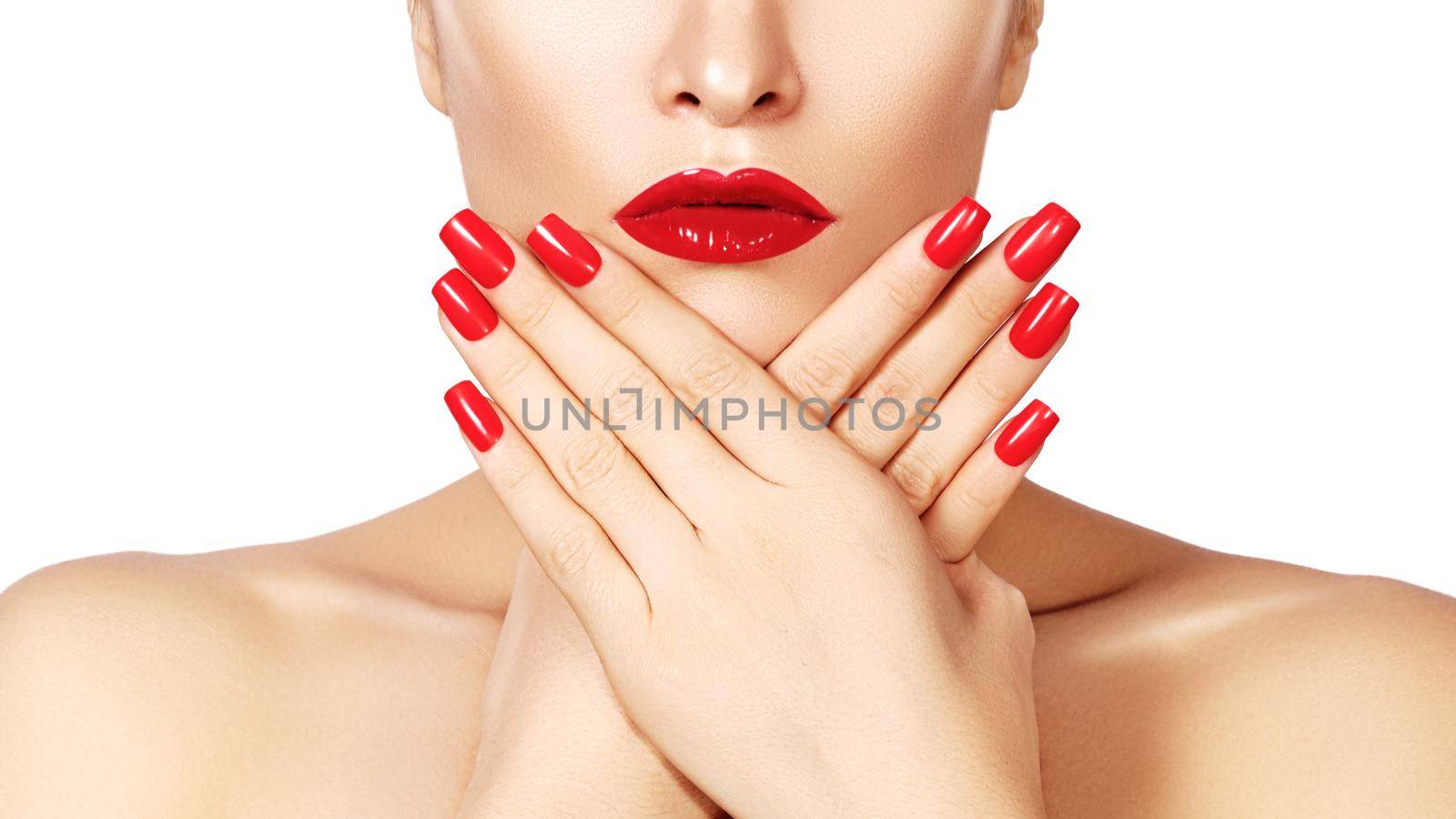Red lips and bright manicured nails. Sexy open mouth. Beautiful manicure and makeup. Celebrate make up and clean skin. Kiss