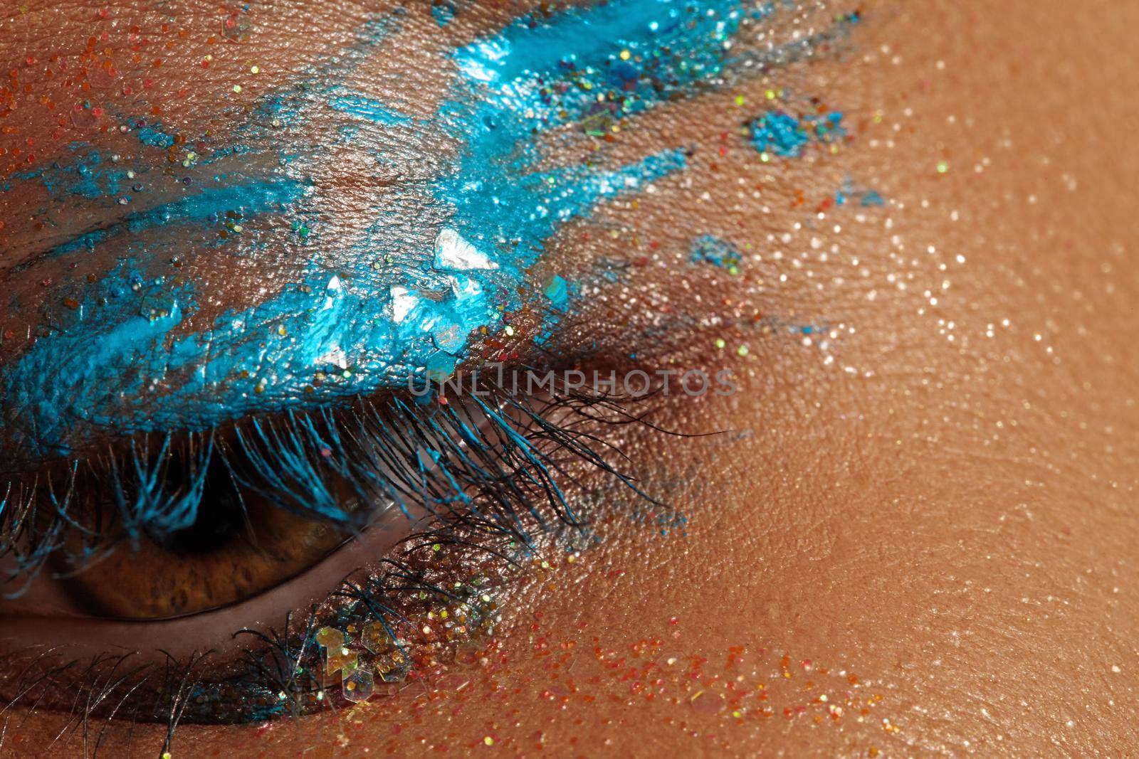 Close-up Creative art make-up. Cream Texture design on female Eye Lid. Makeup with aquamarine paint and bronze pigment by MarinaFrost