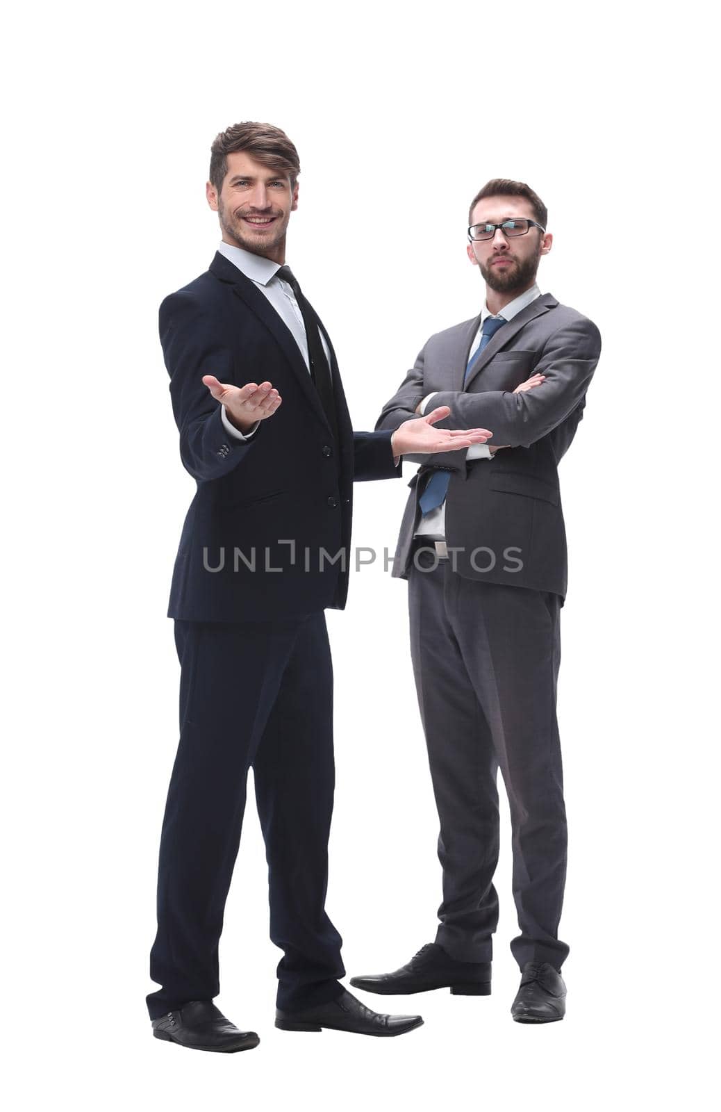 in full growth. two businessmen standing together. isolated on white background.