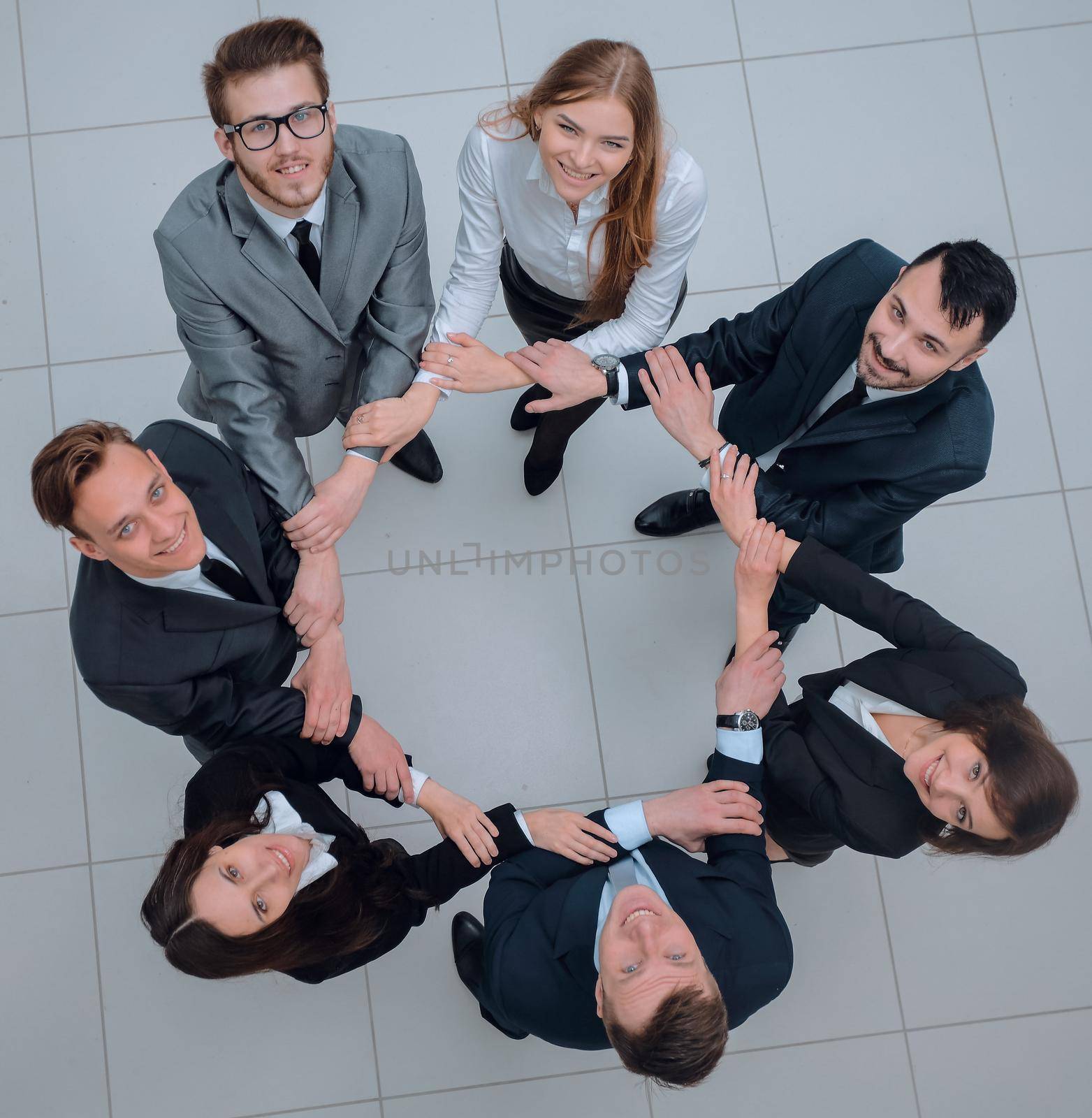 concept of partnership. business people standing in a circle. by asdf