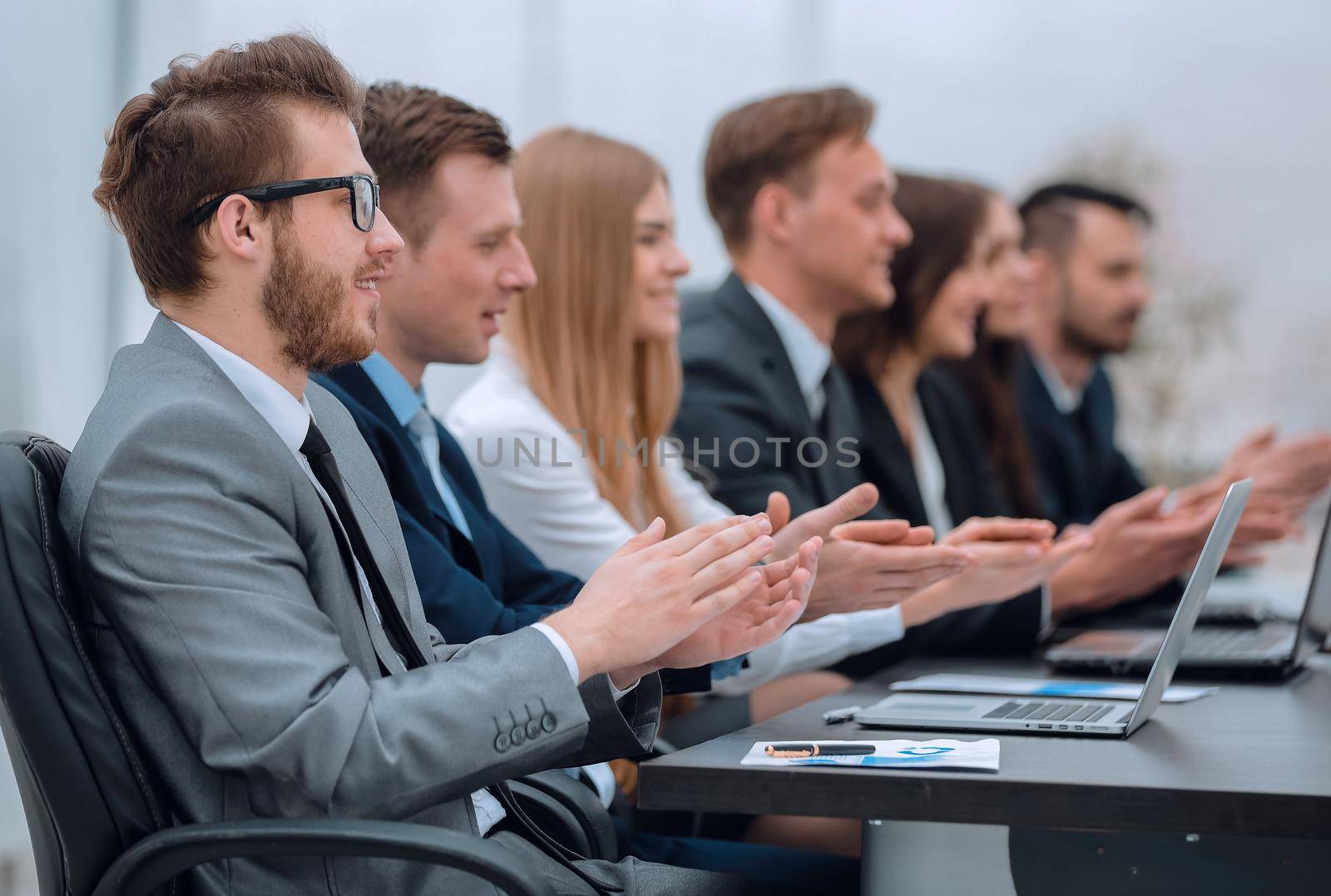 working meeting.business team applauding the speaker