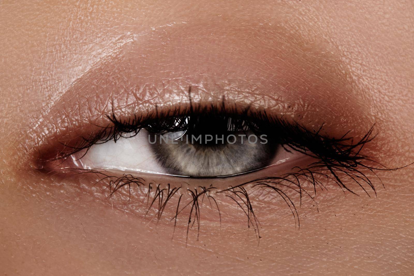 Close-up macro of beautiful female eye. Clean skin, fashion naturel make-up. Good vision.