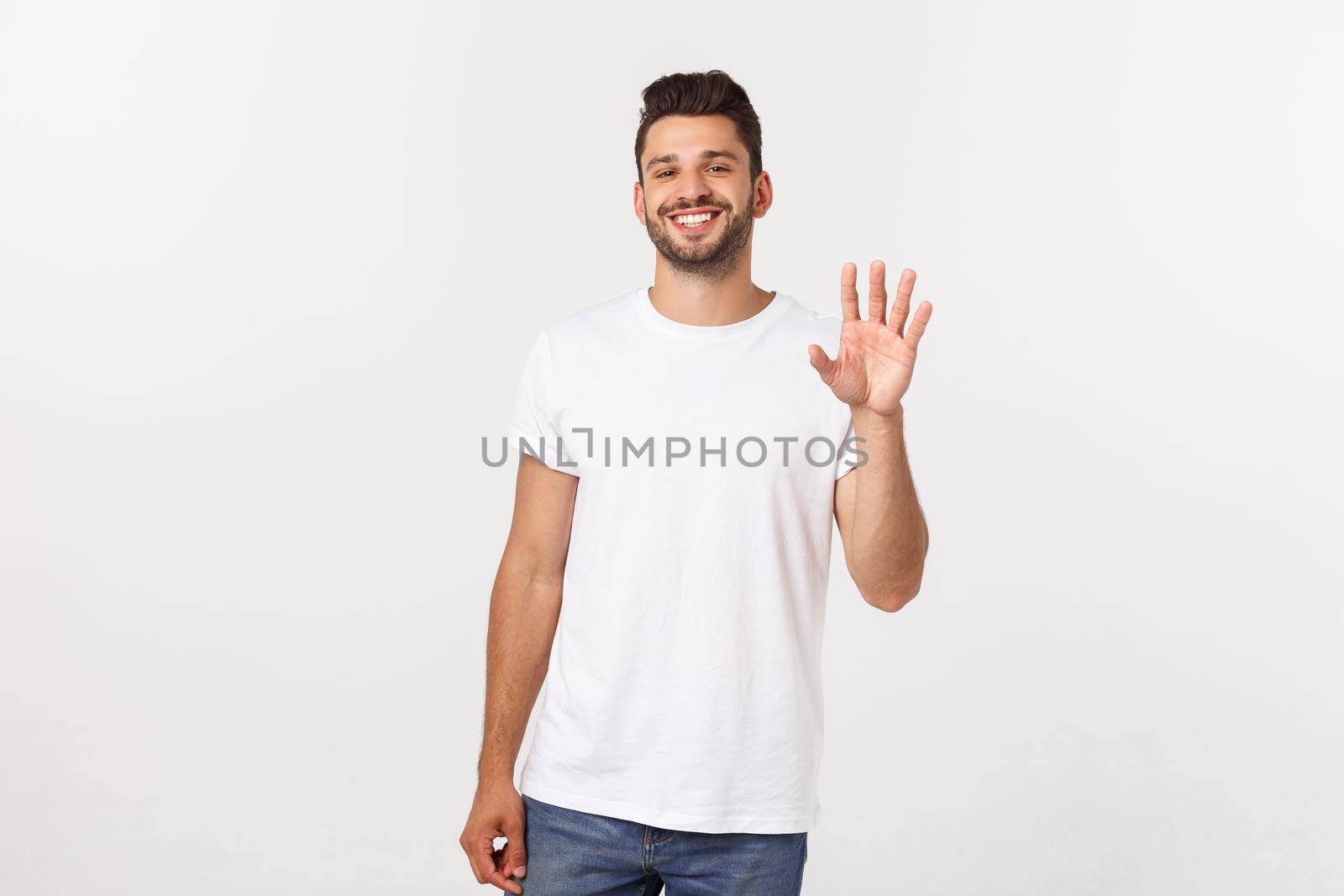 Charming handsome. Handsome young man in casual wear while standing isolated on white background by Benzoix