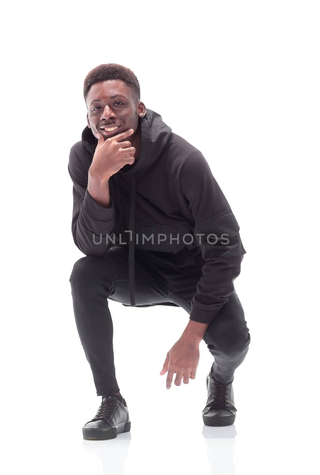 in full growth. confident casual guy looking at the camera . isolated on white background