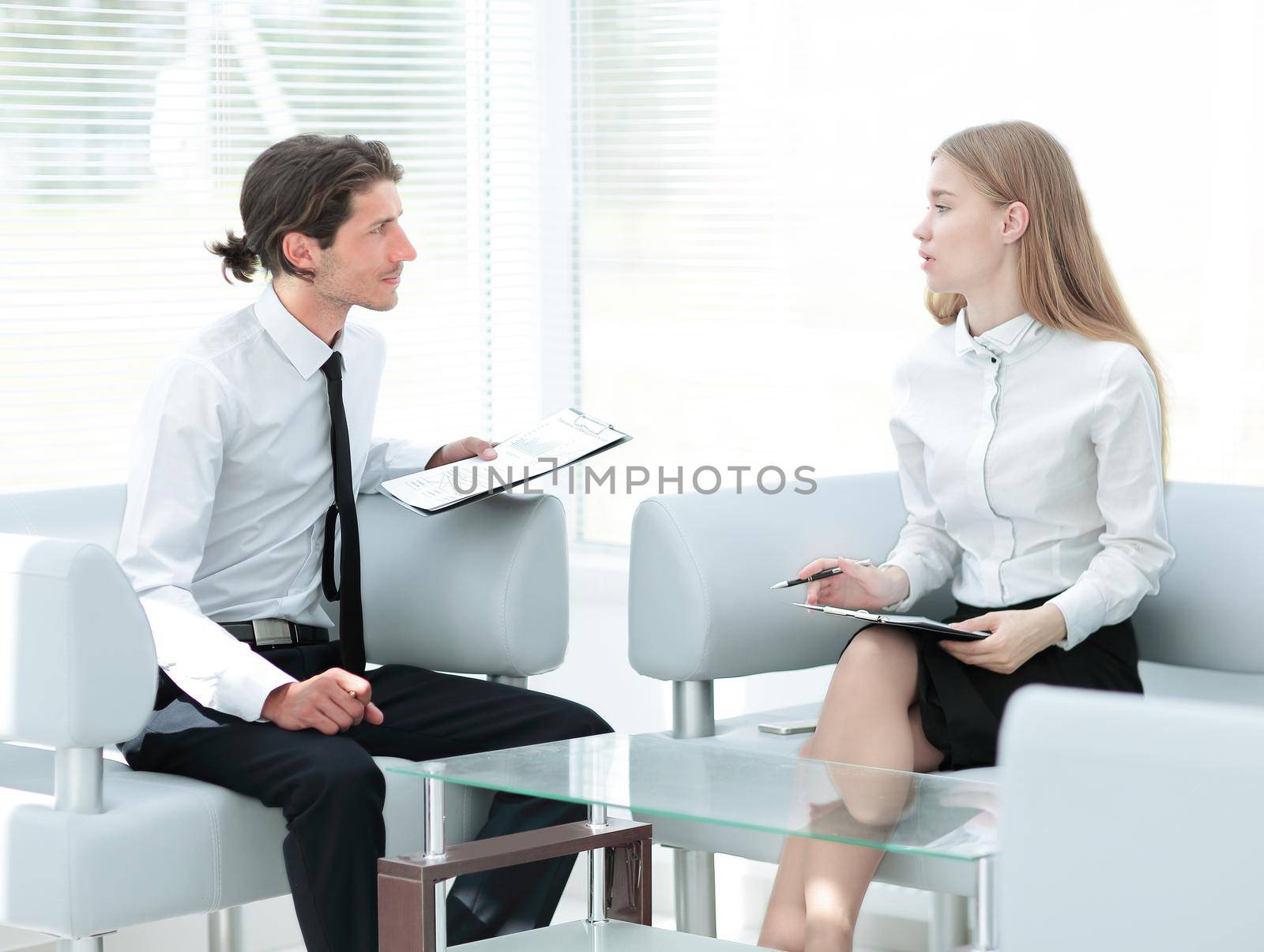 businessman examining a working paper,sitting in the office.photo with copy space