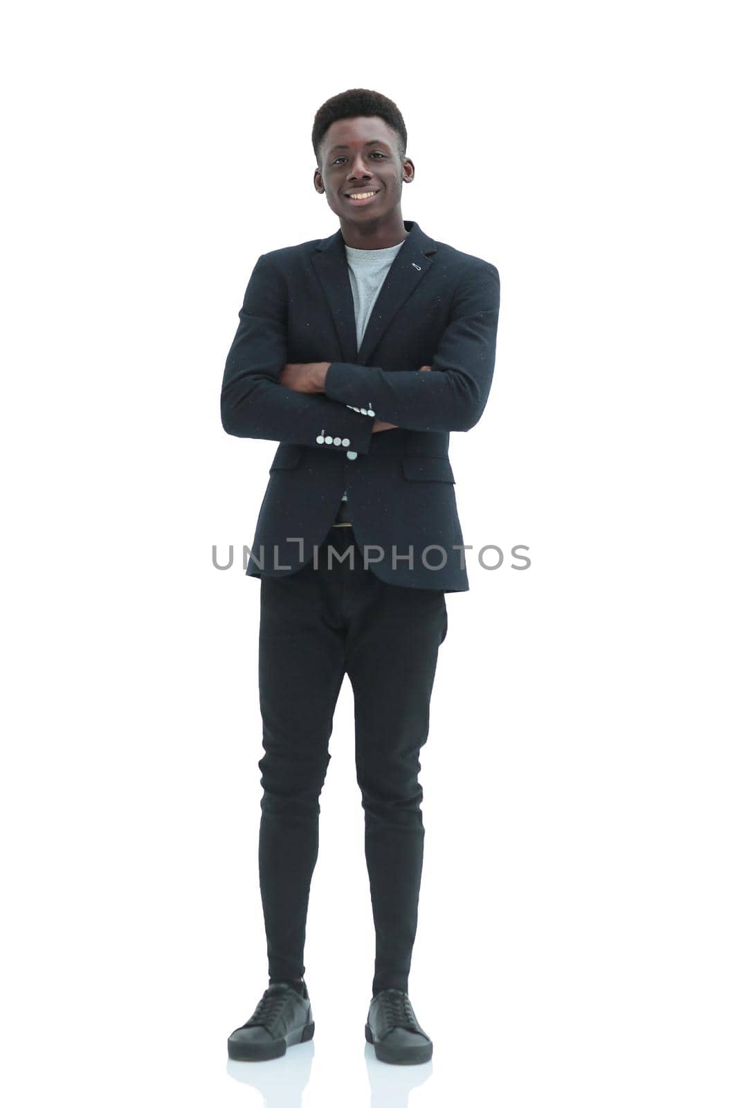 in full growth. portrait of a confident young businessman. isolated on white background