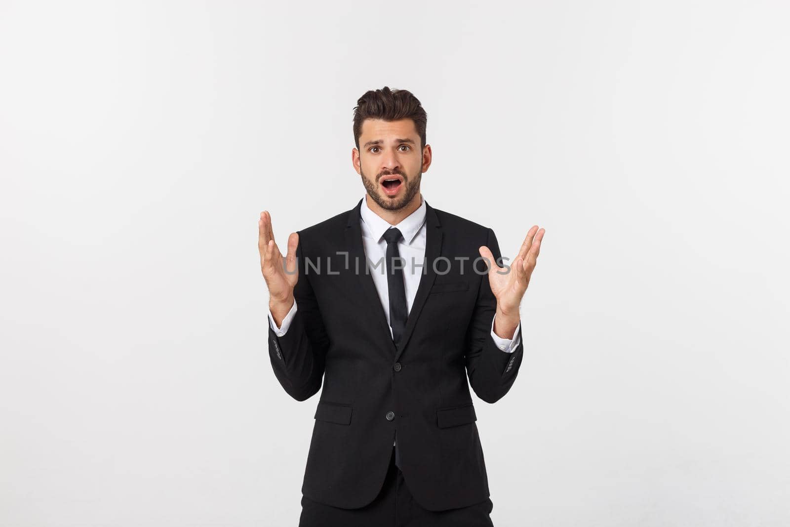 Shocked surprised businessman looking at camera with big eyes. isolated on white, looking at camera.