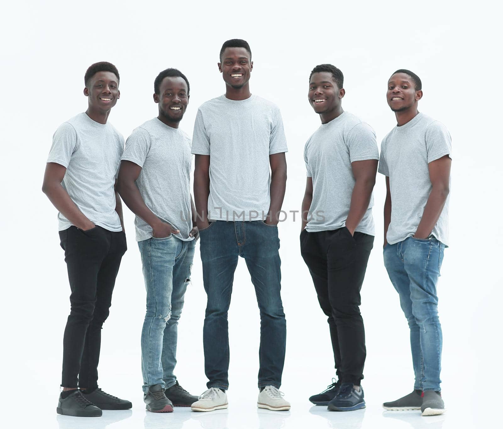 group of smiling guys standing together. isolated on white background