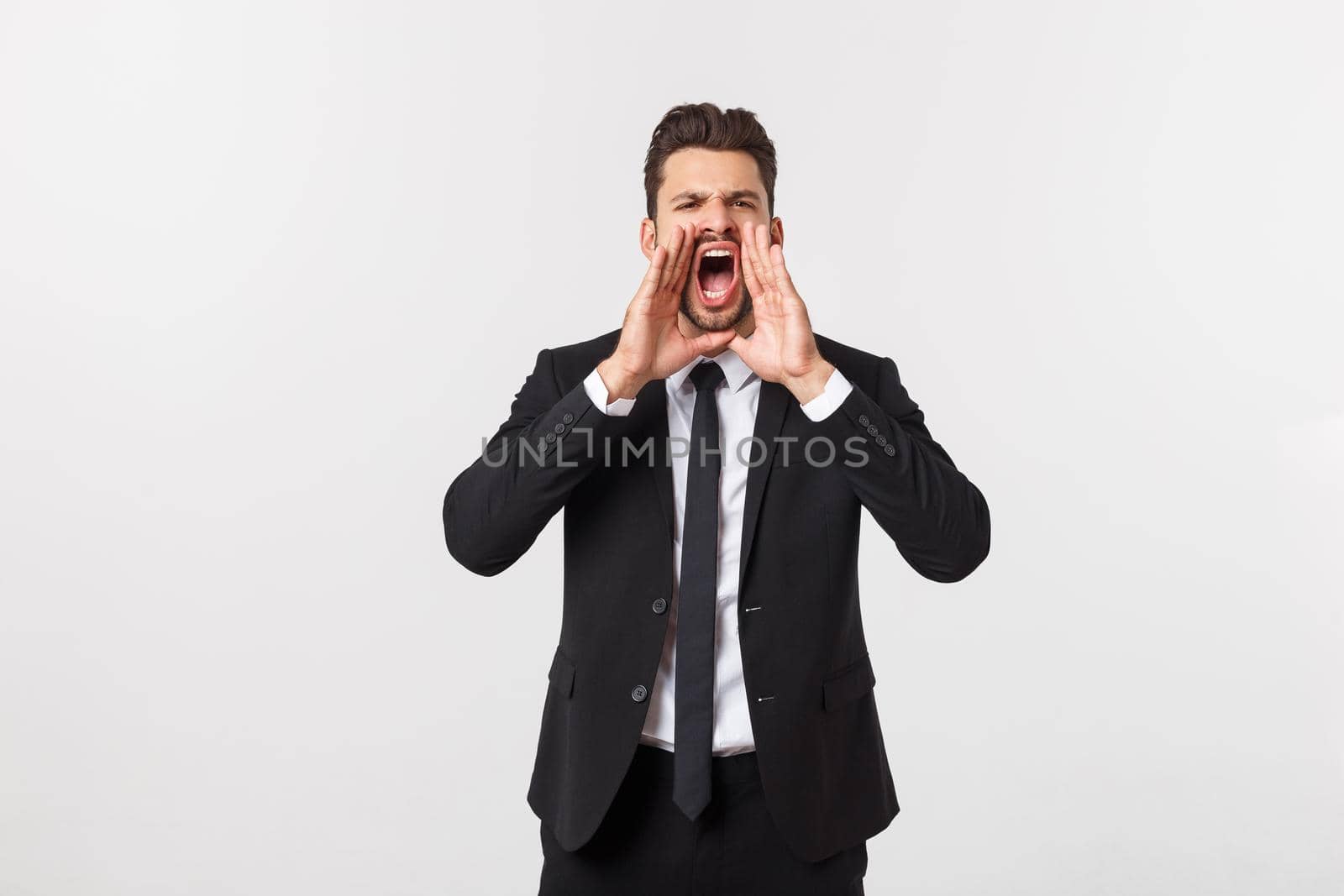 Businessman with long beard over isolated background shouting with mouth wide open.