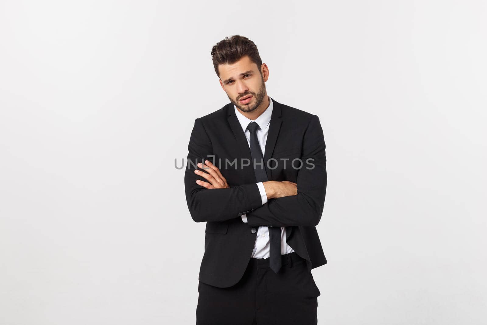 Happy smiling businessman looking at camera with satisfaction, isolated on white background.