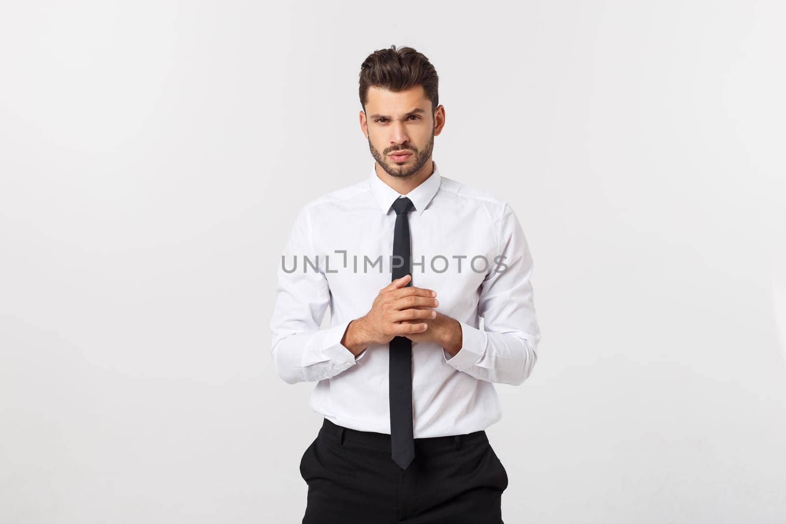 Business Concept - Portrait Handsome Business man holding hand with confident face. White Background. by Benzoix