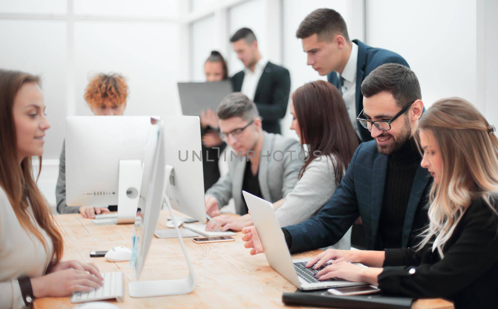 professional employees work on computers in a modern office. photo with copy space