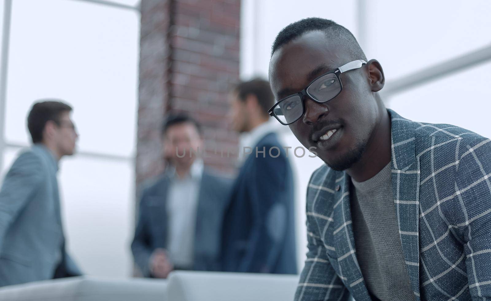 close up. businessman sitting in the lobby of the office.photo with copy space