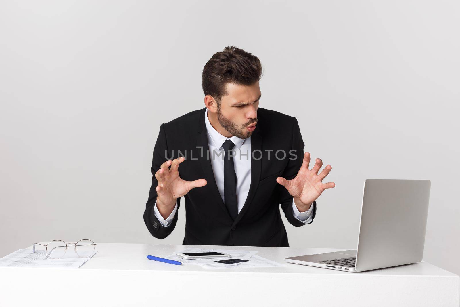 young man shocked with something he see on his laptop computer