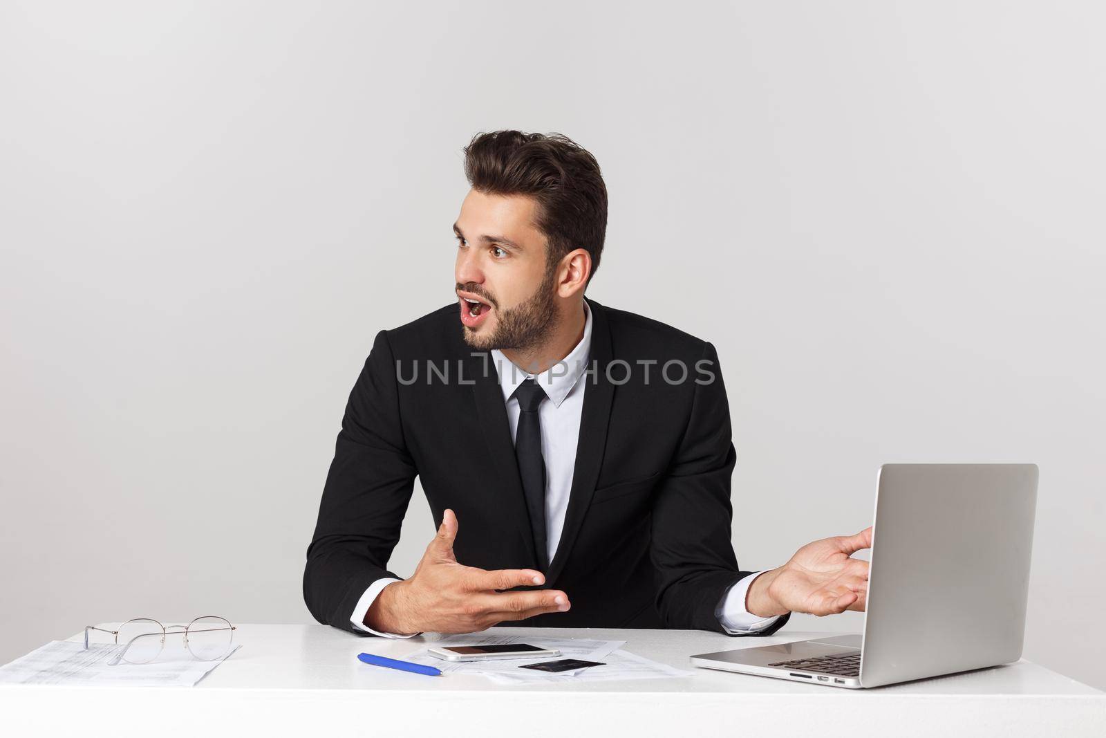 young man shocked with something he see on his laptop computer