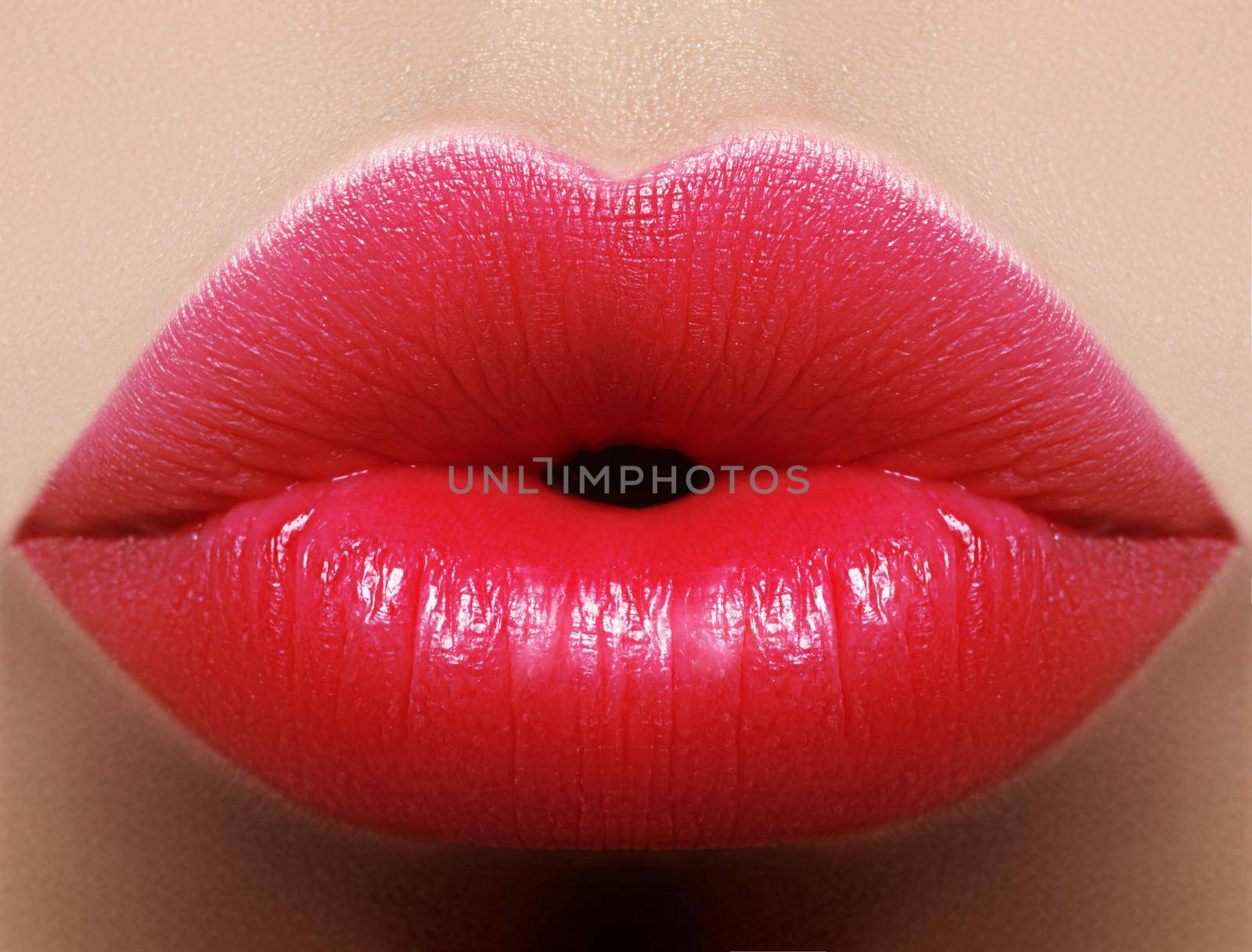 Close-up perfect red lip makeup beautiful female mouth. Plump sexy full lips. Macro photo face detail. Perfect clean skin, fresh lip make-up. Beautiful juicy lips