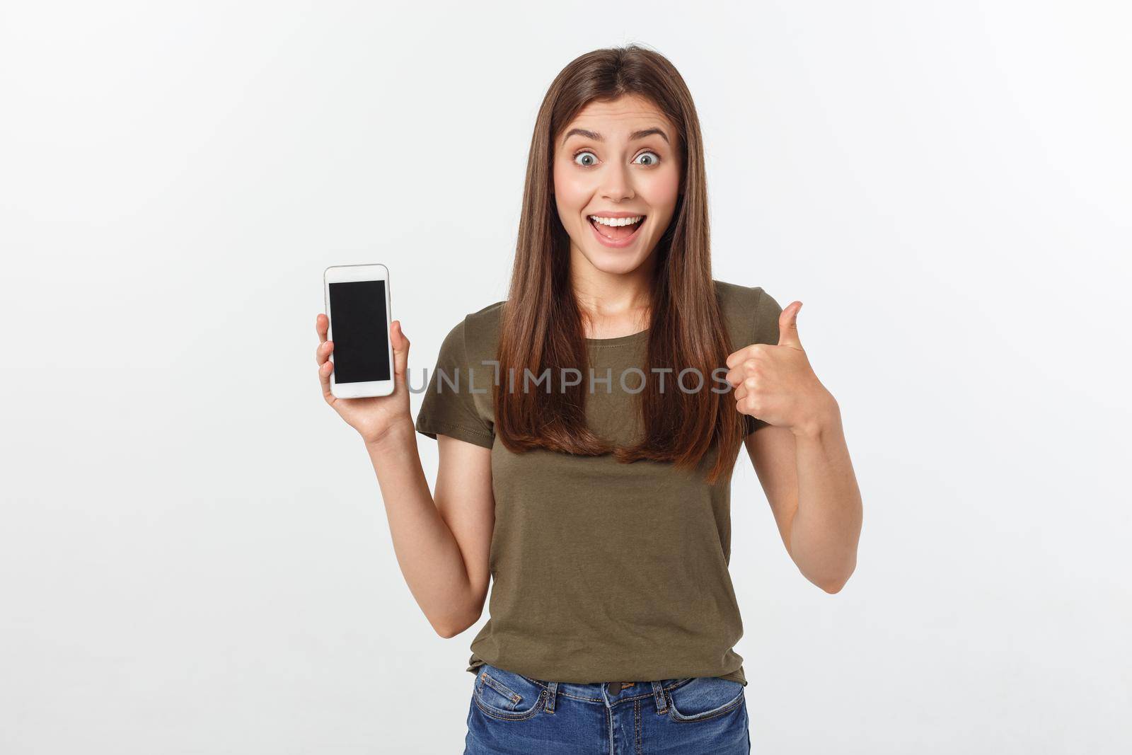 Girl Holding Smart Phone - Beautiful smiling girl holding a smart phone.