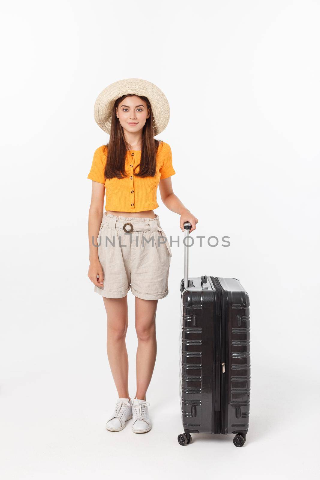 Woman tourist. Full length happy young woman standing with suitcase with exciting gesturing, isolated on white background