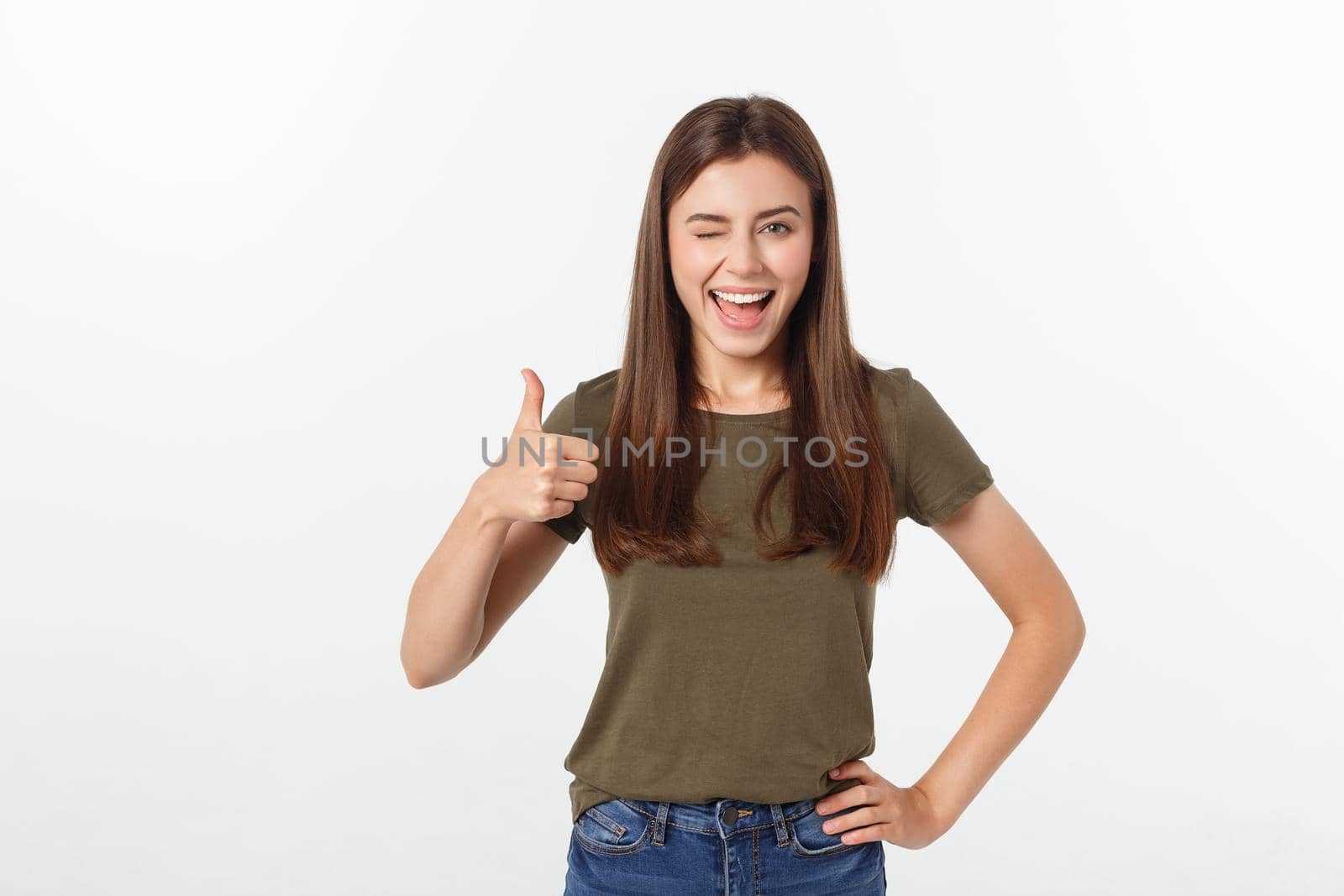 Closeup portrait of a beautiful young woman showing thumbs up sign. Isolate over white background. by Benzoix