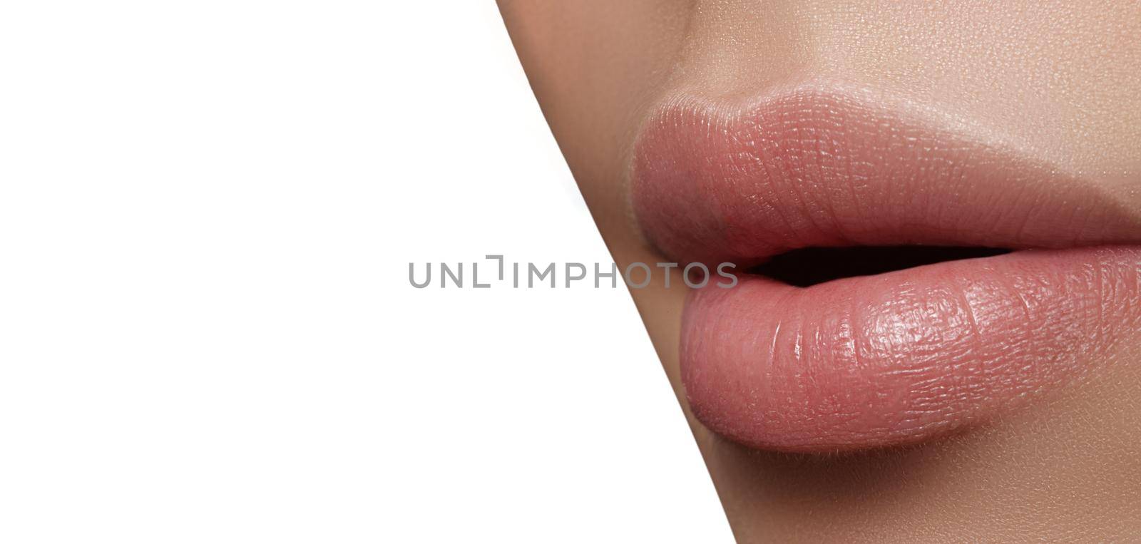 Closeup perfect natural lip makeup. Beautiful plump full lips on female face. Clean skin, fresh make-up. Spa tender lips by MarinaFrost