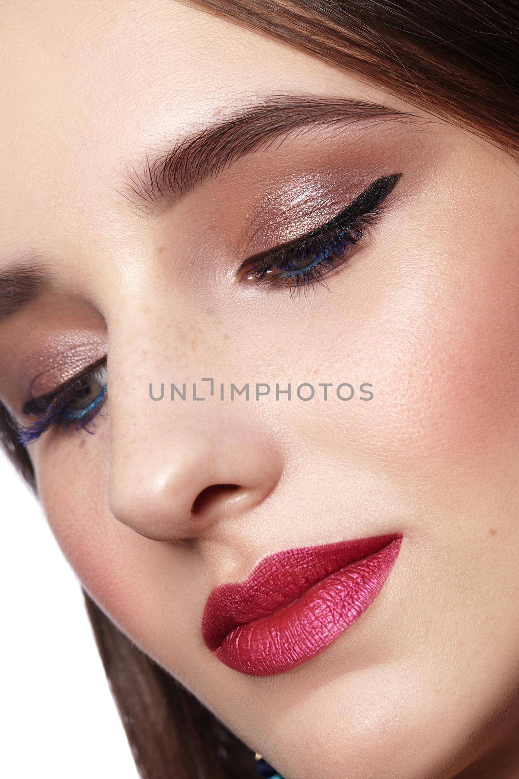 Beautiful Woman with Professional Makeup. Celebrate Style Eye Make-up, Perfect Eyebrows, Shine Skin. Bright Fashion Look.