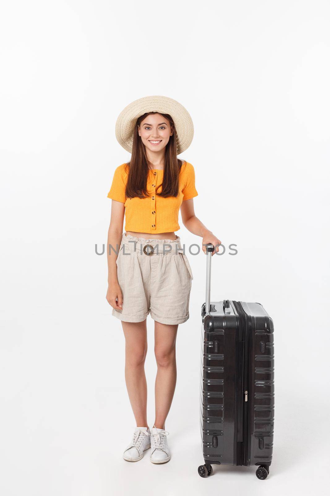 Woman tourist. Full length happy young woman standing with suitcase with exciting gesturing, isolated on white background. by Benzoix