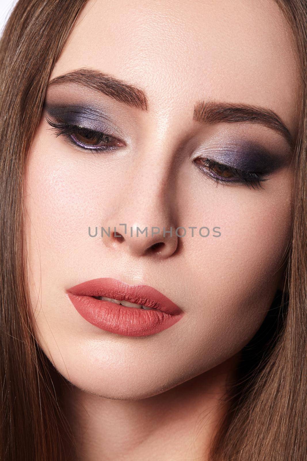 Beautiful Woman with Professional Makeup. Celebrate Style Eye Make-up, Perfect Eyebrows, Shine Skin. Bright Fashion Look.