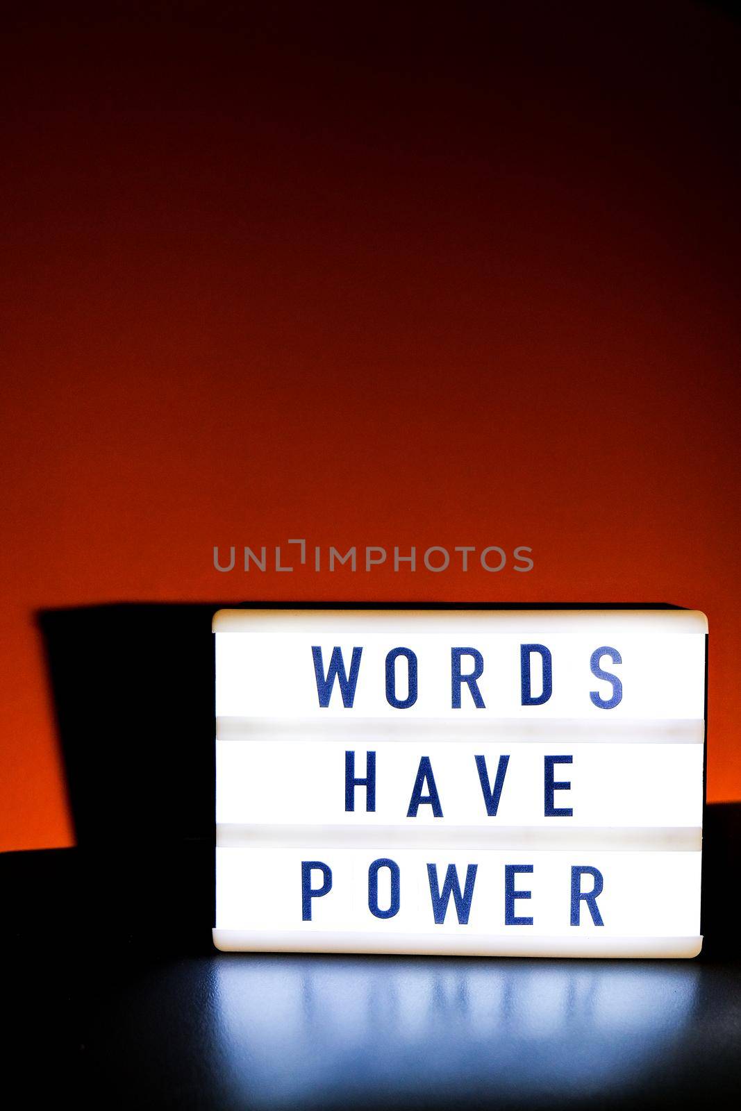 Lightbox with text WORDS HAVE POWER. Motivational Words Quotes Concept. Colorful background. Minimalistic creative concept.