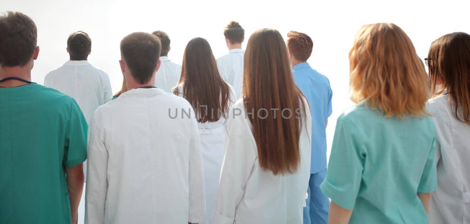 group of diverse doctors looking at the blank screen by asdf