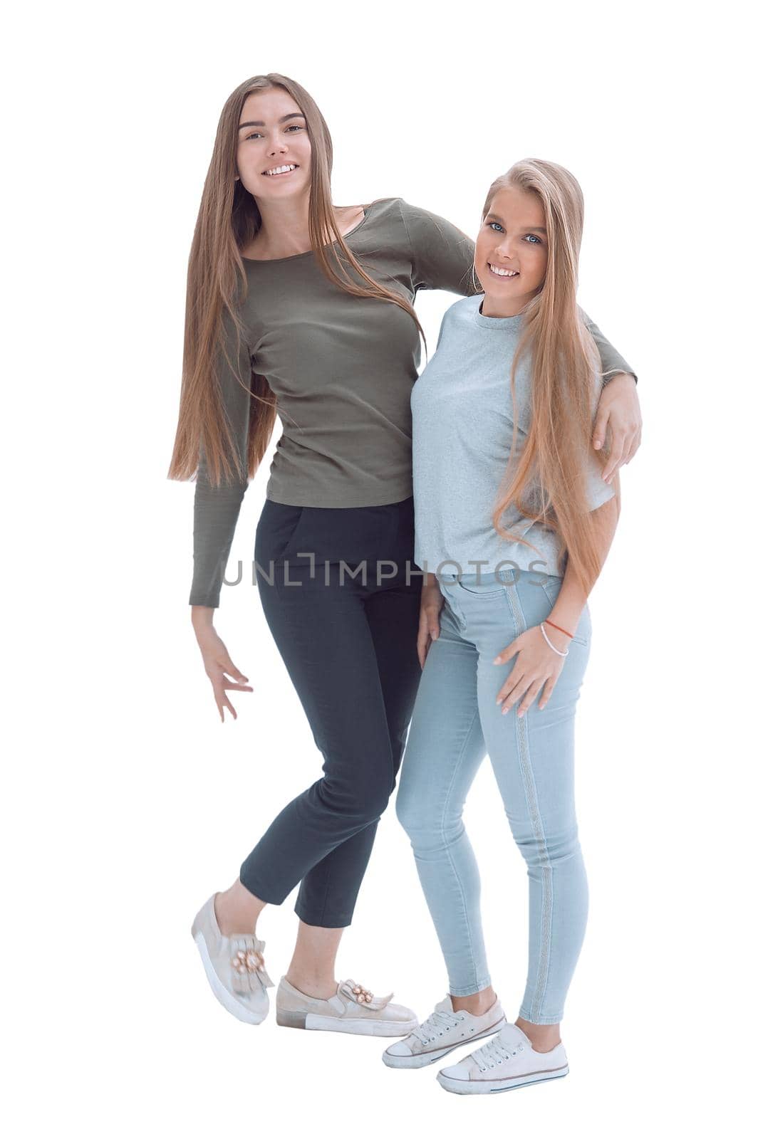 in full growth. two happy girlfriends standing together . isolated on white