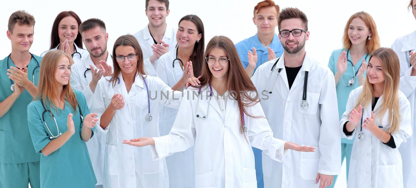 group of confident young doctors stand together by asdf