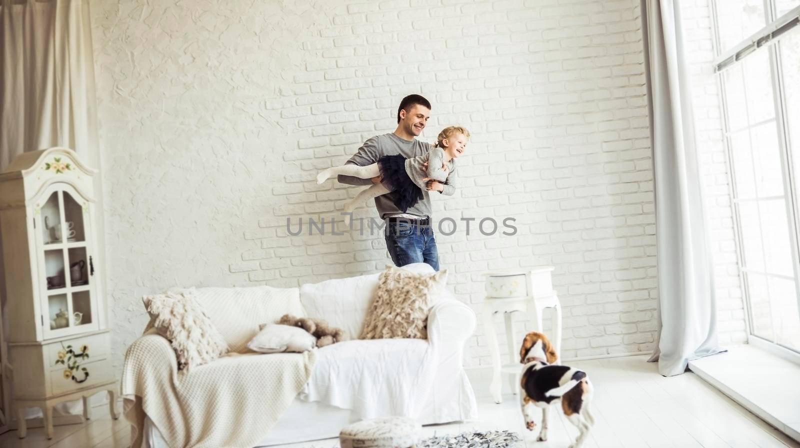 loving father plays with his baby daughter by SmartPhotoLab
