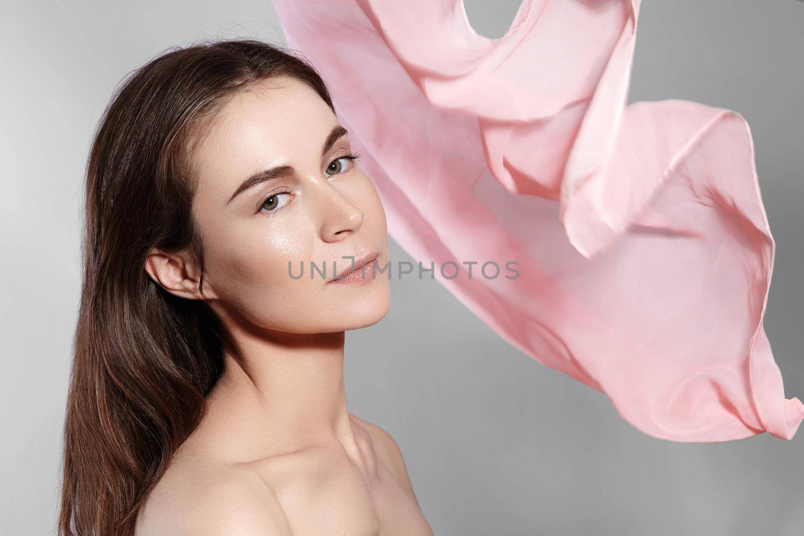 Happy Girl. Natural Make-up and Accessories. Beautiful Romantic Style of Young Woman with Waving Silk Scarf. Tender Light Fabric