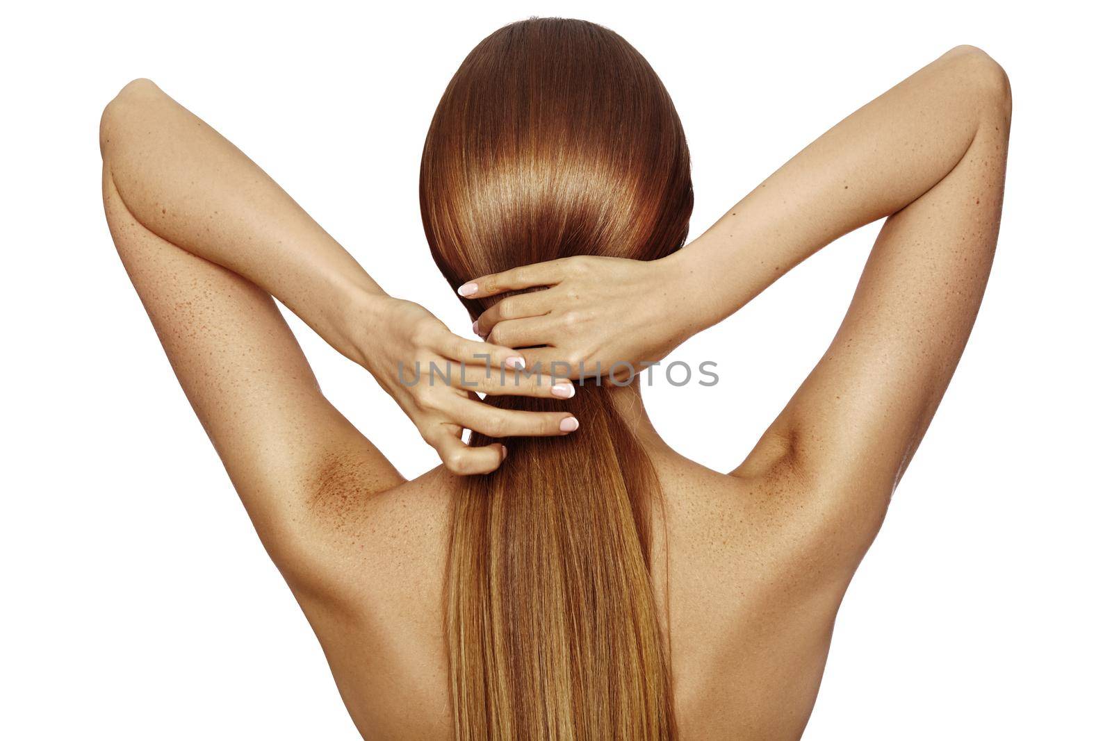 Healthy Shiny Long Hair in Tale. Beautiful Girl holding her Hair in hand. Back view on white. Smooth Hairstyle with strong Hair