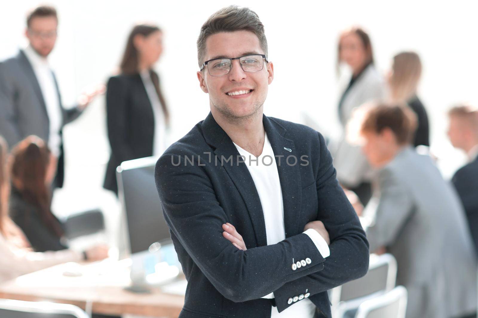 successful business man standing in the office. business concept