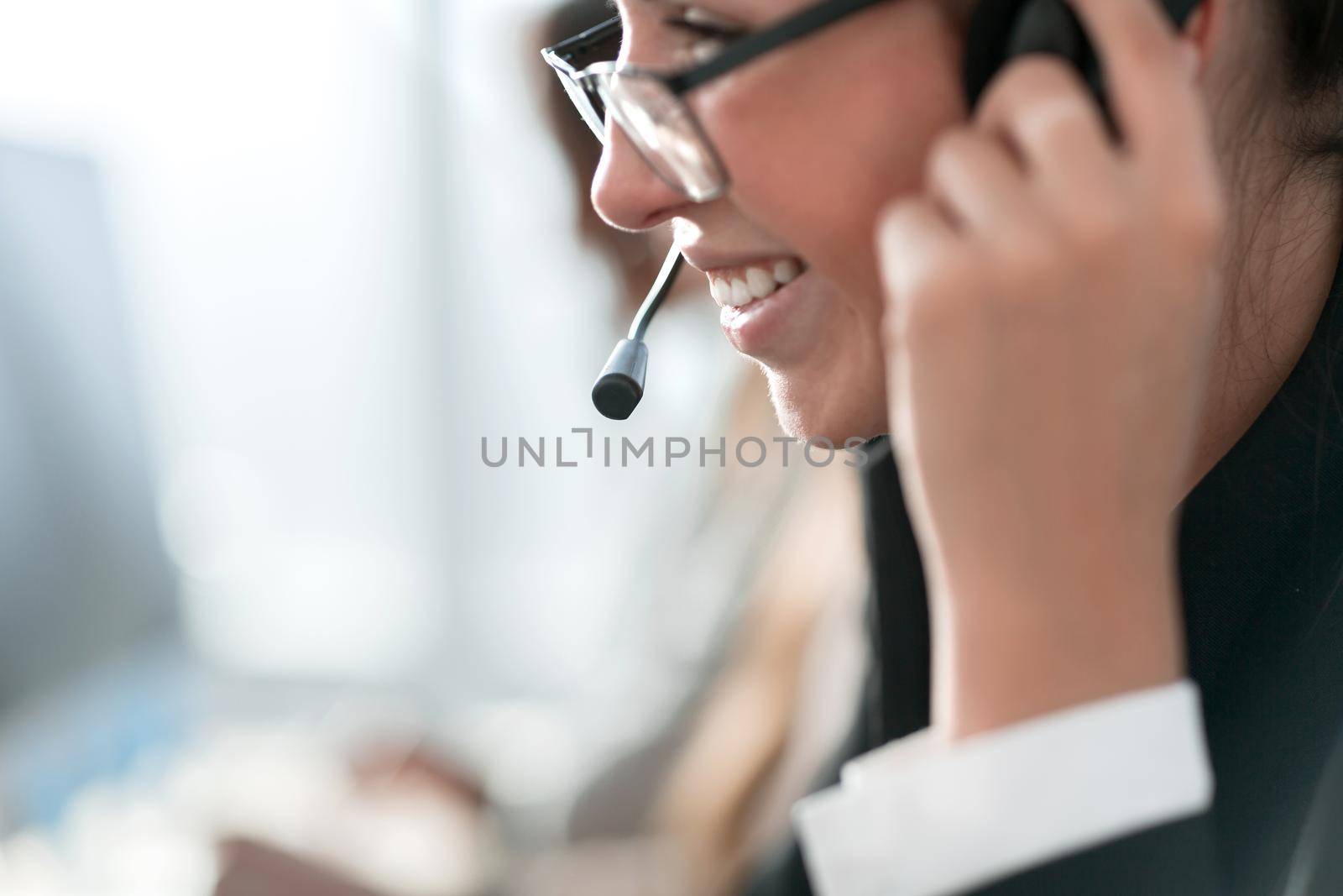 close up. the female operator communicates with the client. photo with copy-space