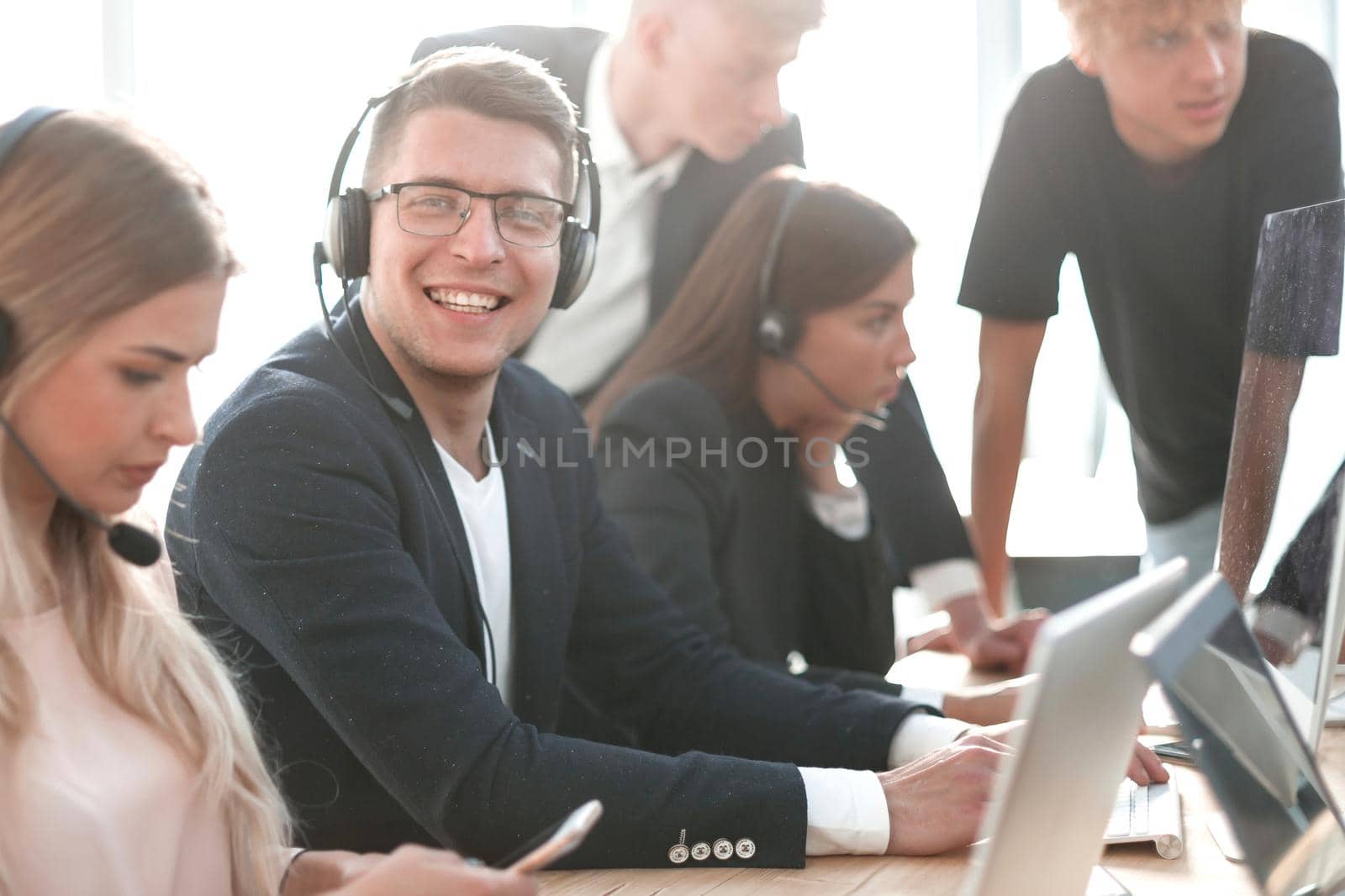 close up. a businessman with a young business team works in a modern office