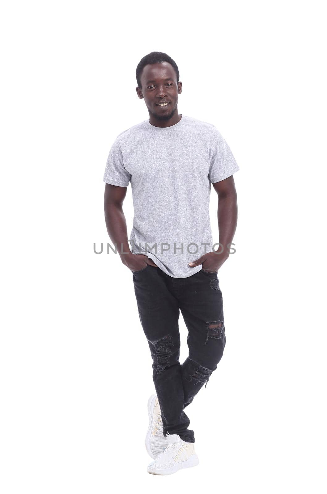 in full growth. handsome guy in jeans and a t-shirt . isolated on white