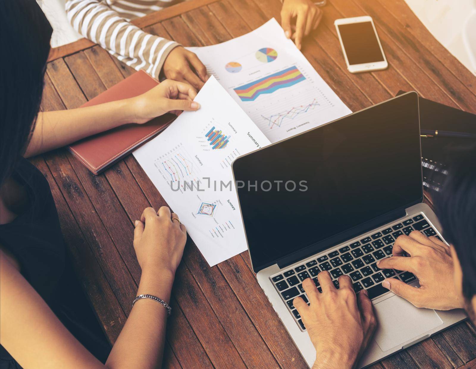 Business man using laptop computer in a business group meeting. Business report meeting and briefing. Business teamwork concept.