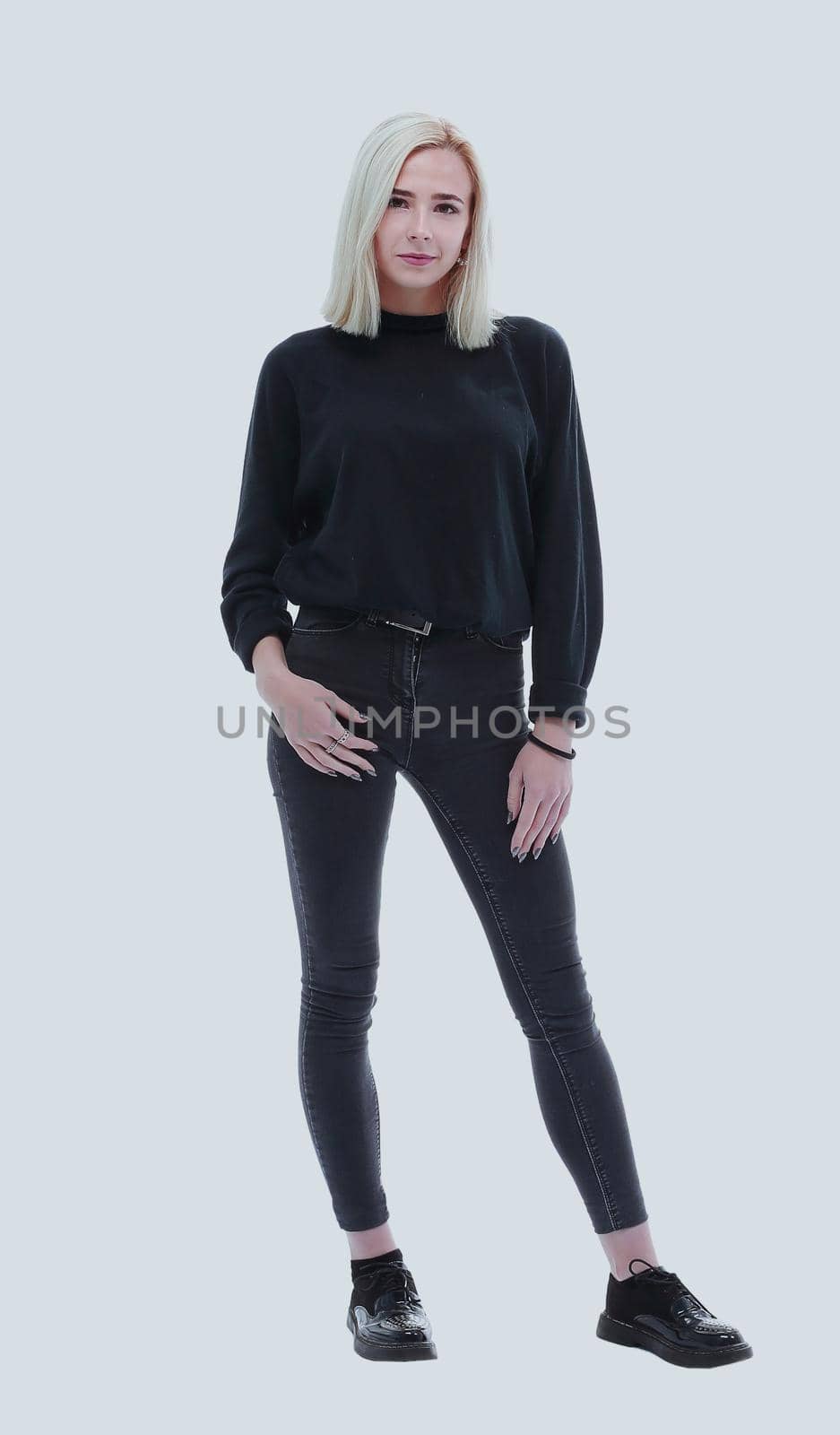 in full growth. beautiful female model in jeans and black blouse . isolated on white