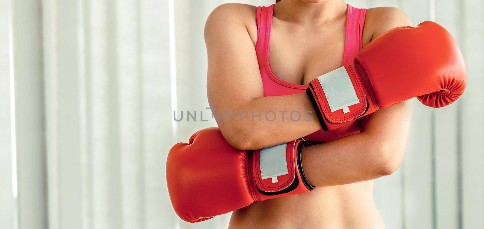 Boxer woman does boxing sport in fitness gym. by biancoblue