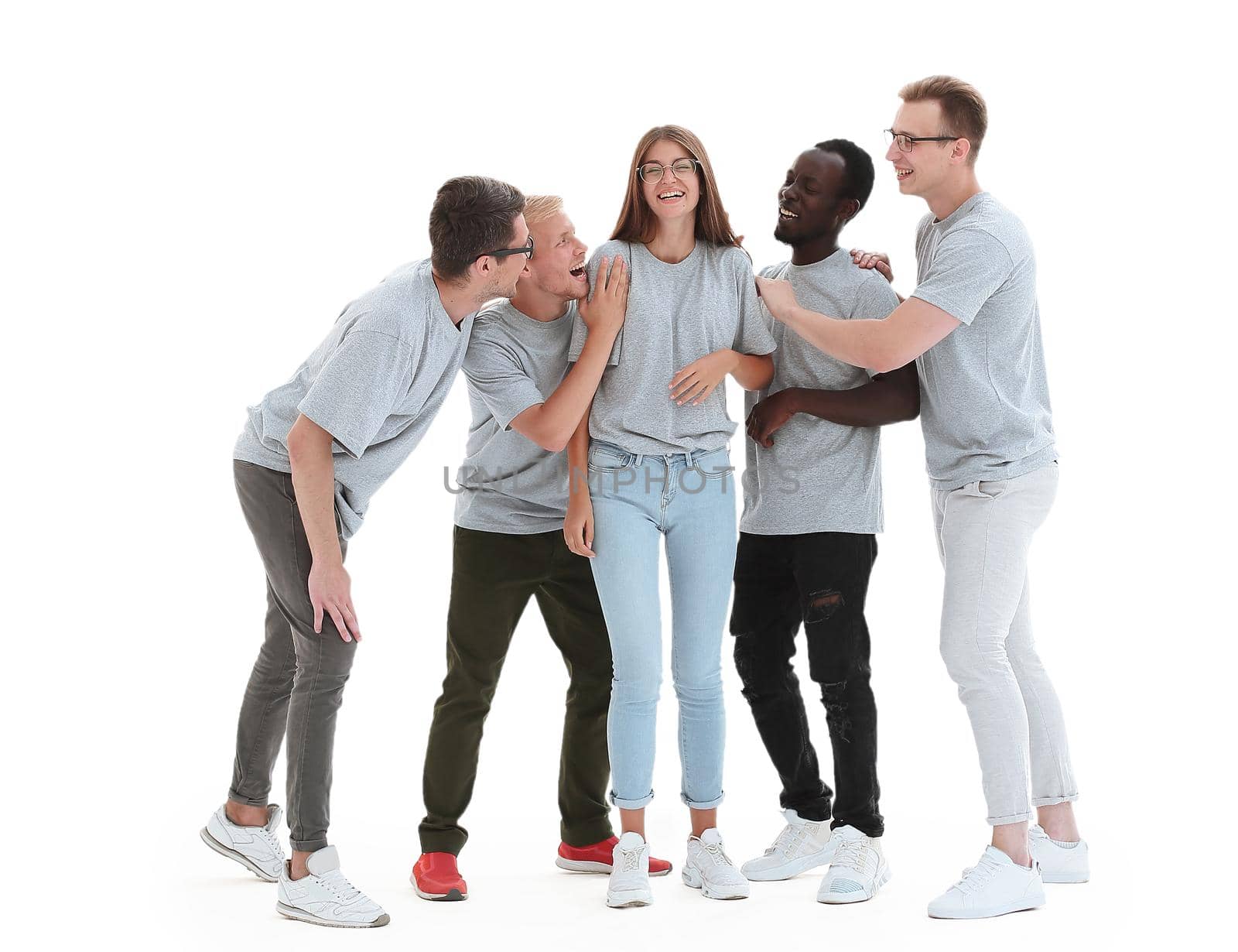 in full growth. group of diverse young people in identical t-shirts. isolated on white background