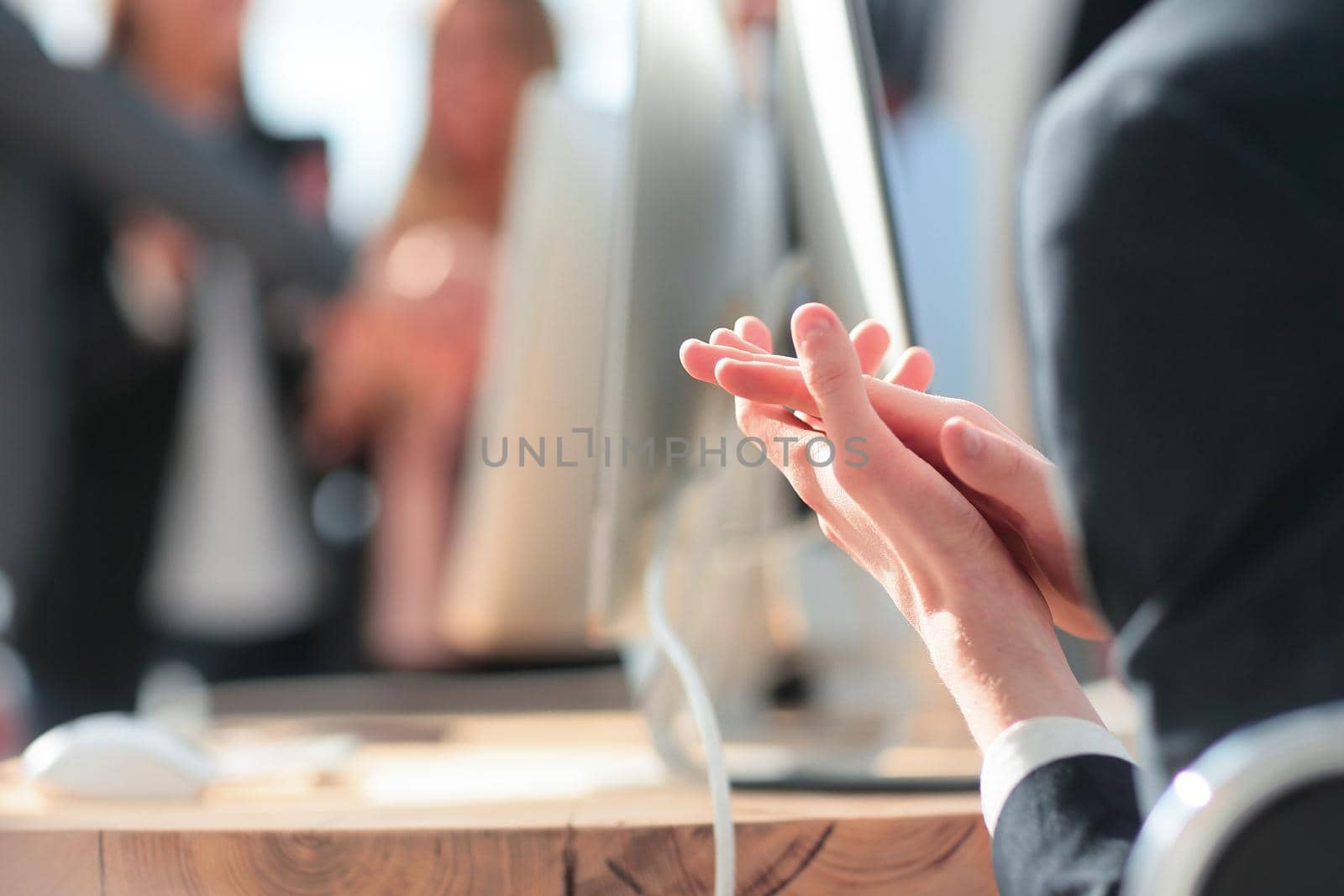 close up. the business team applauds at a business meeting in the office