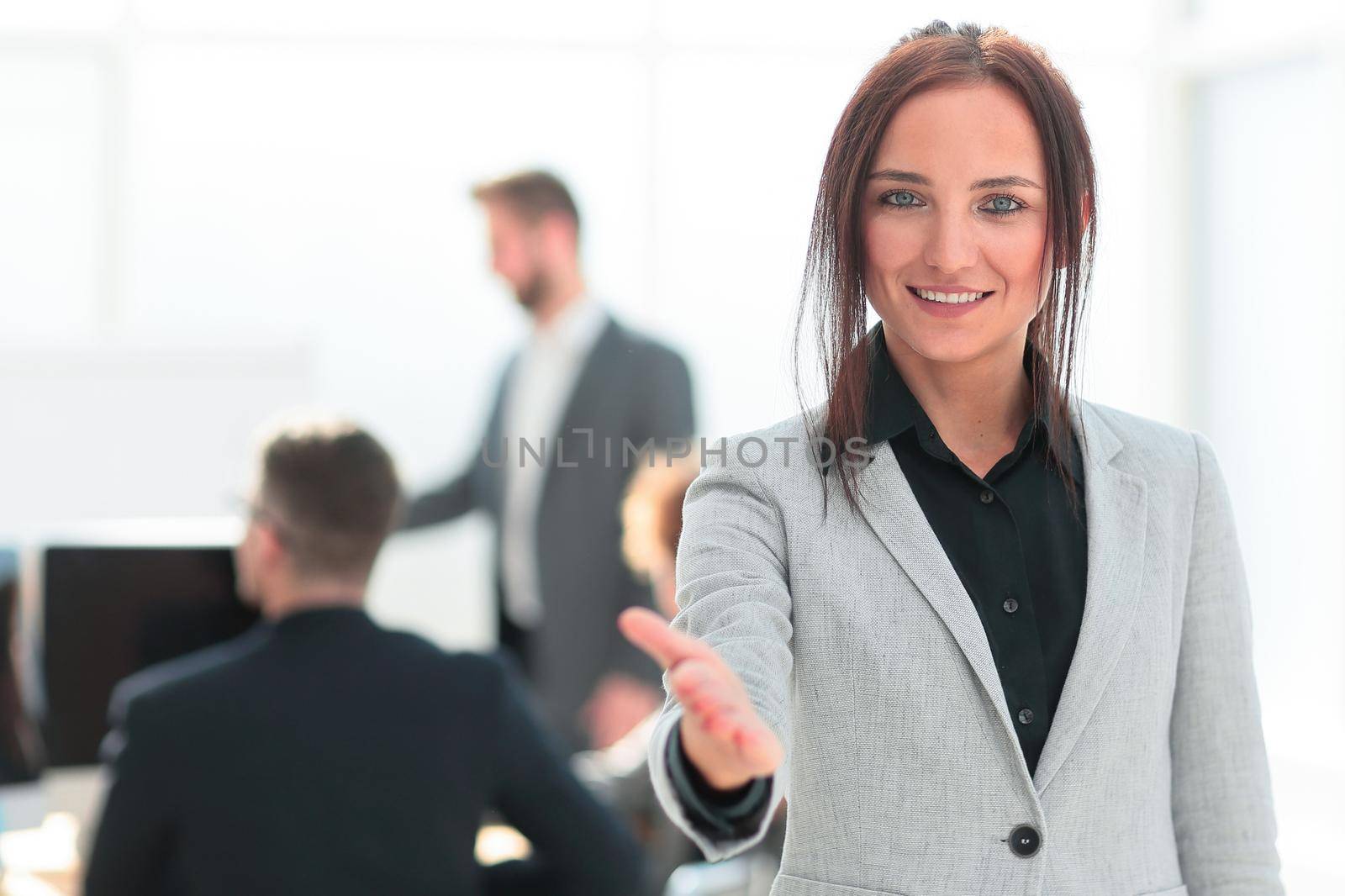 portrait of a successful young business woman on an office background. photo with a copy of the space