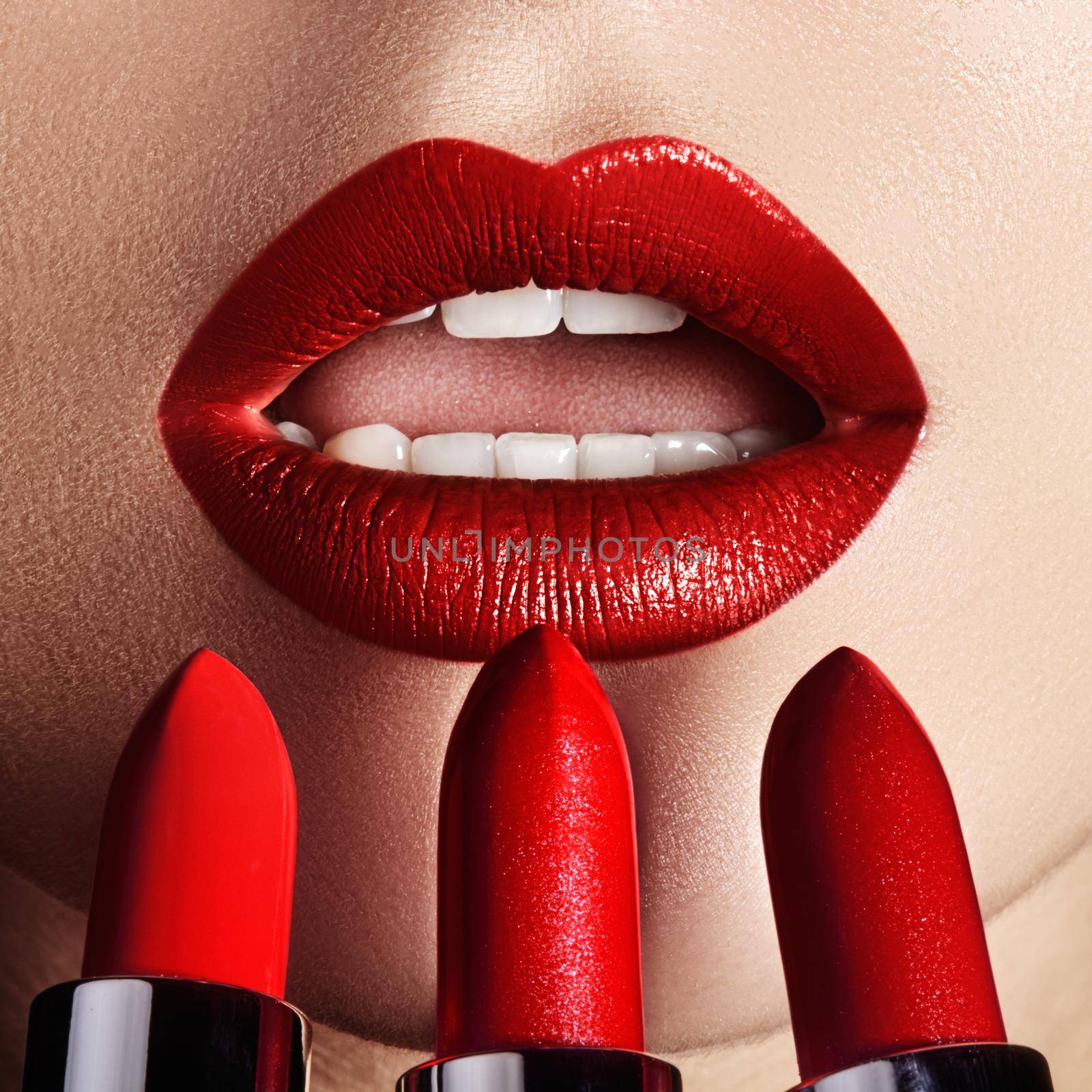Close-up of woman's lips with fashion red make-up. Macro shot of beautiful make up on full lips. Choice lipstick by MarinaFrost