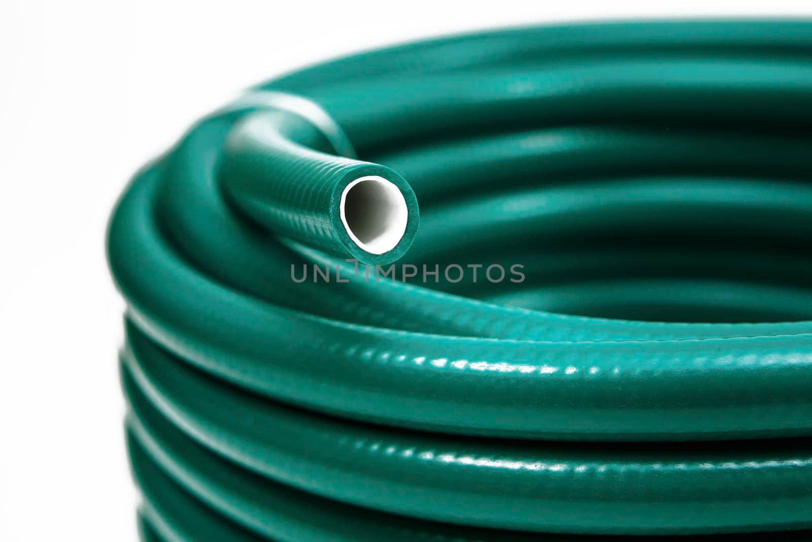 Hose wrapped in a bobbin and fastened with a plastic lock
