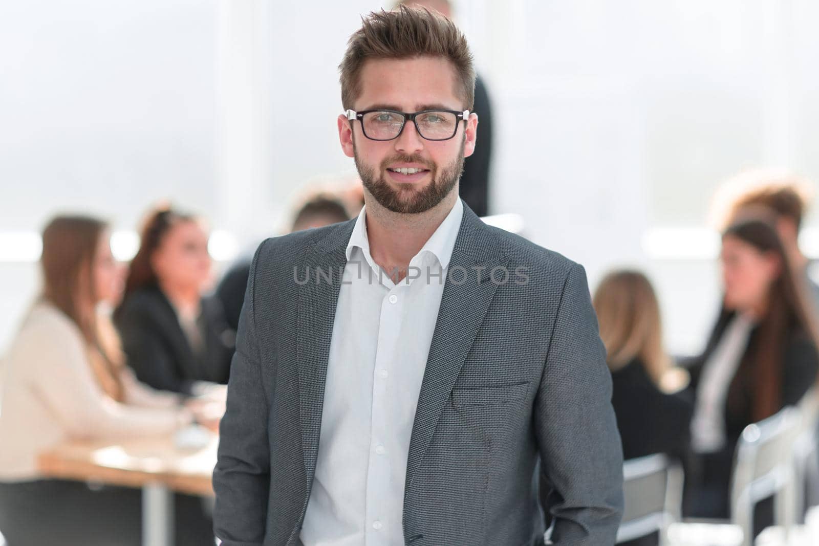 close up. confident businessman standing in his office. business concept