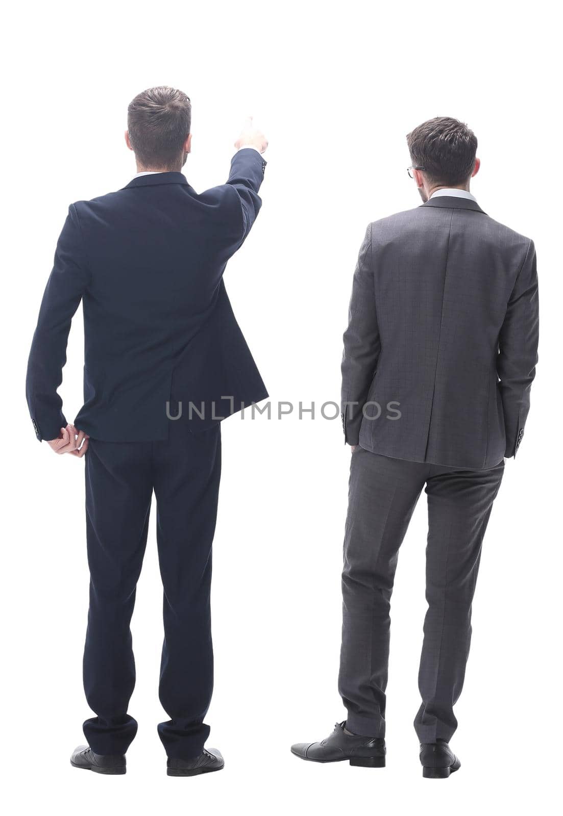rear view. two businessmen looking at copy space. isolated on white background.