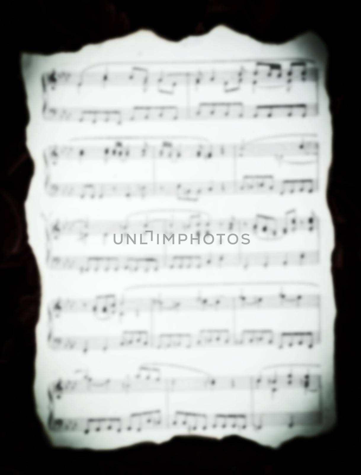 vintage music sheet with burnt edges .photo with copy space in rasfokus