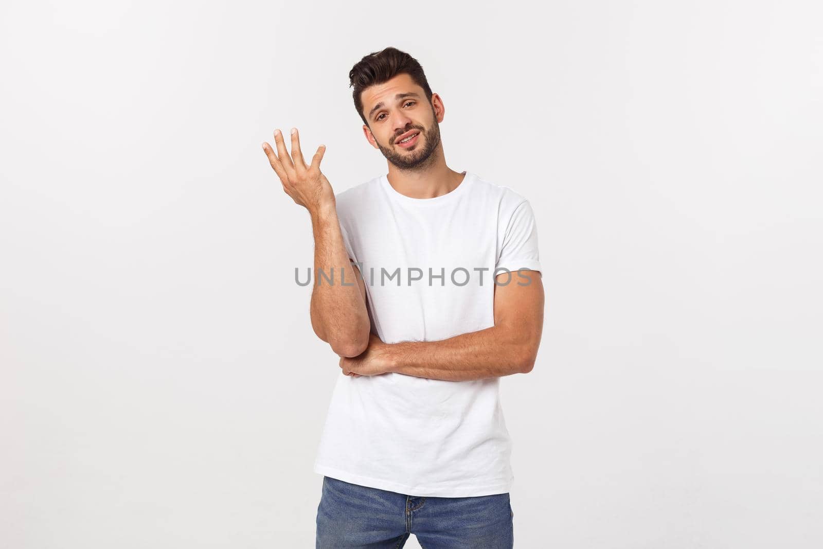 Close up portrait of disappointed stressed bearded young man in shirt over white background